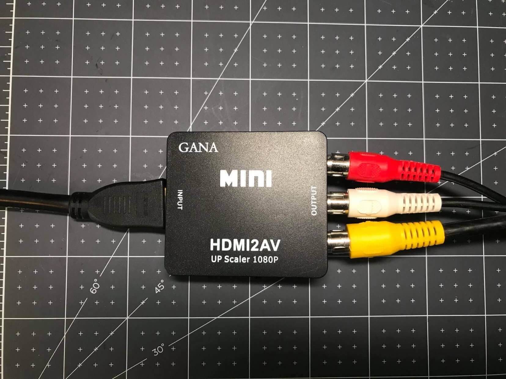 An HDMI to RCA Converter Box With Cables Attached